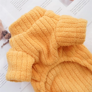 Close-up of thick ribbed fleece pet sweater in orange with soft coral velvet texture