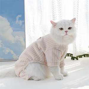 Detailed view of light pink ribbed pet sweater with back zipper on a white long-haired cat