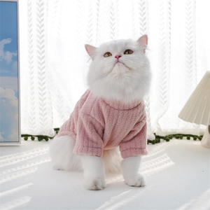 Close-up of thick light pink fleece pet sweater with vertical ribbed texture for small dogs
