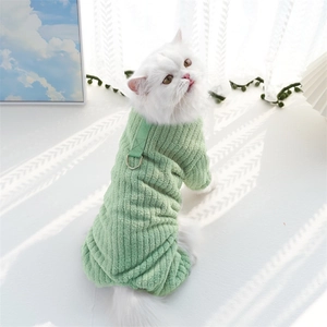Close-up of light green flannel pet jumpsuit with ribbed texture and metal D-ring leash attachment