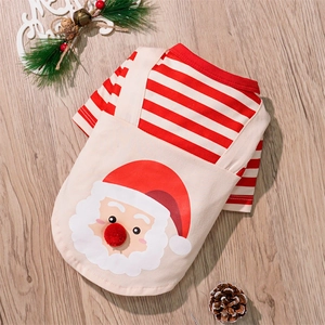 Detailed flat lay of Santa Claus dog outfit with red stripes and beige suspenders