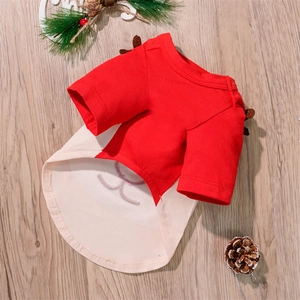 Detailed view of reindeer antler Christmas dog shirt on natural wood background