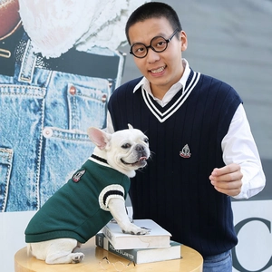 Matching knit vests for dog and owner featuring classic V-neck stripes and embroidery