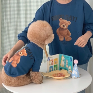 Matching navy blue fleece pet and owner sweatshirts with teddy bear print and text