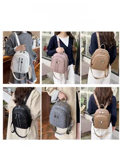 Detail of grid patterned leather backpack showing five colors and three carrying modes