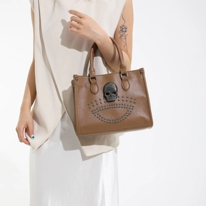 Vintage brown leather tote bag with metallic skull and studs detailing for women