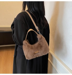 Detailed view of the soft plush texture and premium brown faux fur on the shoulder bag