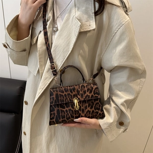 Fashionable leopard print square handbag with gold clasp and adjustable shoulder strap