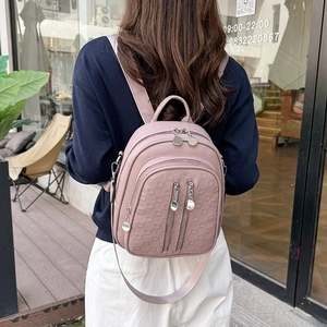 Pink purple faux leather backpack with square embossing and silver zipper accents