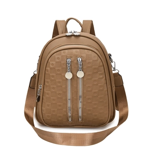 Brown geometric embossed backpack with dual silver zippers and removable shoulder strap