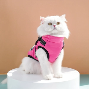 Detail of rose pink warm pet vest featuring reflective straps and adjustable back buckles