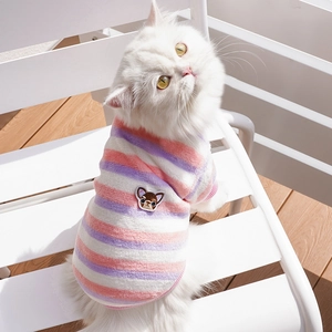 Close-up of pink striped flannel pet sweater with dog embroidery on a white cat