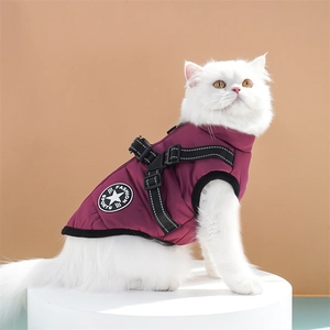 Detail view of burgundy pet winter vest with integrated harness and fashion patch