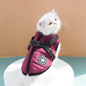 Detail of burgundy dog winter vest with integrated harness and secure zipper closure