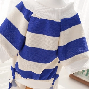 Macro detail of royal blue striped knit pet sweater with ribbed edges for small dogs