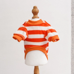 Detail of orange and white striped pet sweater with warm fleece fabric and ribbed cuffs