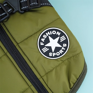 Detail of the waterproof dog vest showing a heavy-duty zipper and reflective safety straps