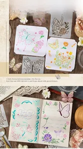 Detail of butterfly and floral stencil templates for DIY journaling on wooden desk