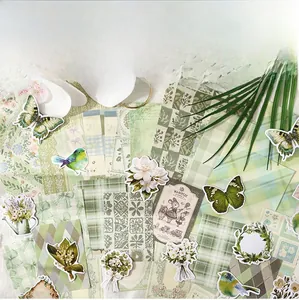 Detailed view of vintage green botanical scrapbooking stickers with butterflies and flowers