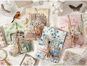 Macro detail of vintage scrapbook set with 100 pieces of floral and lace paper materials