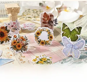 Detail of vintage flower stickers set with sunflowers and butterflies for DIY journaling