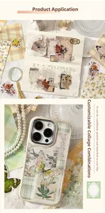 Detail of vintage scrapbooking stickers with butterflies and floral motifs on a notebook