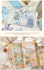 Detail showing vintage DIY journaling kit with floral stickers and lace paper decoration