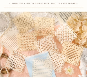 Detailed close-up of hollow lace paper stickers for DIY journaling with vintage decor