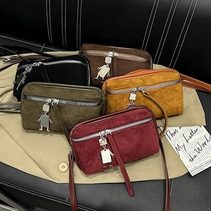 Retro suede crossbody bags in multiple colors with unique robot metal charm detail