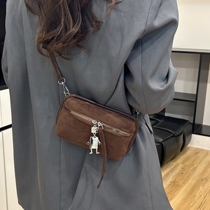 Vintage brown faux suede crossbody bag for women with unique robot pendant detail