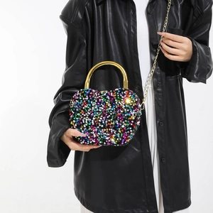 Sparkly heart shaped sequin evening clutch bag with gold handle and chain strap