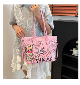 Detail of pink tote bag with cartoon bear graffiti and decorative side drawstrings