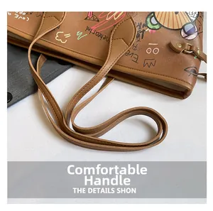 Detail of sturdy brown tote bag handles with colorful graffiti and precise stitching