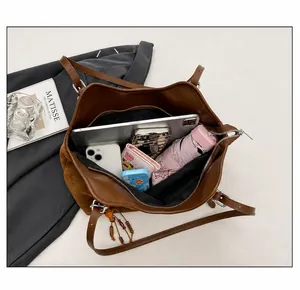 Top view of large brown tote bag showing spacious interior for tablet and essentials