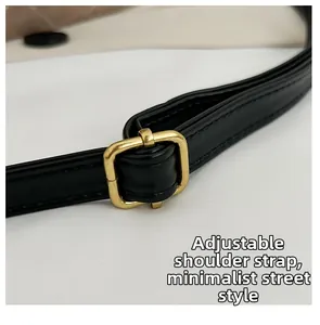 Detailed shot of black leather adjustable strap with premium golden metal buckle