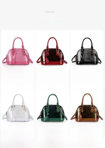 Macro detail of glossy snake embossed shell bags in six different vibrant colors