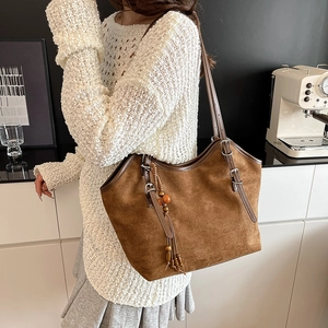 Vintage dark brown suede tote bag with long leather handles and wood bead tassel charm