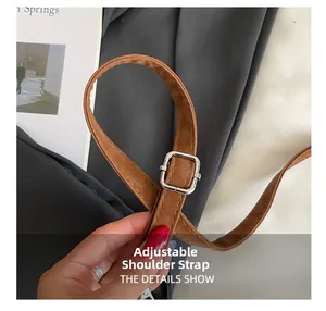 Close-up of brown litchi leather adjustable strap with silver buckle for crossbody bags
