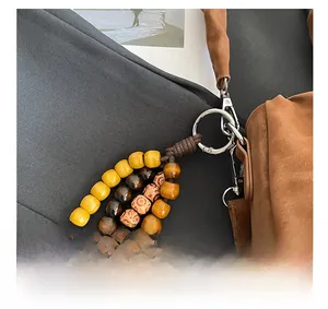 Close-up of Bohemian beaded bag charm with leopard pattern and vintage stone beads