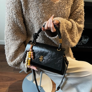 Vintage black oil wax leather handbag with golden lock and colorful wood bead charm