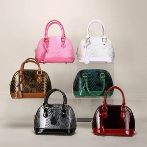 Glossy snake pattern shell handbags in six colors with gold hardware and dual handles