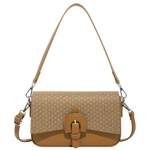 Vintage style brown patchwork shoulder bag with woven flap and adjustable leather strap
