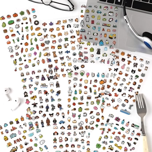 Waterproof cartoon planner stickers set featuring cute animals and food motifs on white desk