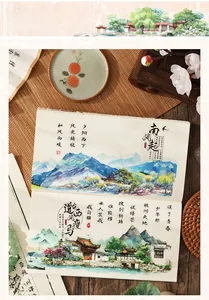 Close-up of Chinese traditional landscape art stickers on a bamboo mat with zen decor