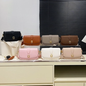 Minimalist square crossbody bags in seven colors with wide straps and gold buckles