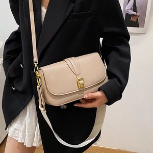 Minimalist beige crossbody box bag with golden buckle and wide fabric shoulder strap