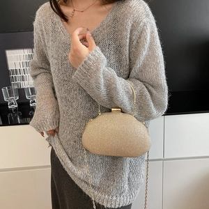 Elegant gold glitter evening clutch bag with metal handle and detachable chain strap