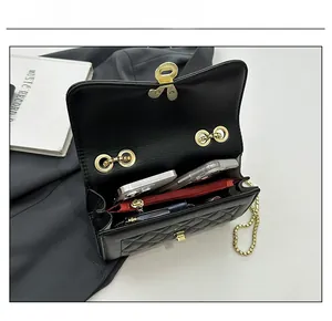 Internal capacity of the quilted crossbody bag showing space for phones and makeup