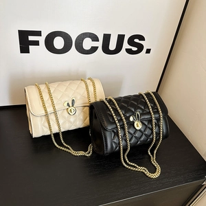Elegant quilted crossbody bags in white and black with golden rabbit metal locks and chains