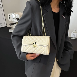 Quilted crossbody chain bag in cream white with golden rabbit clasp and leather texture